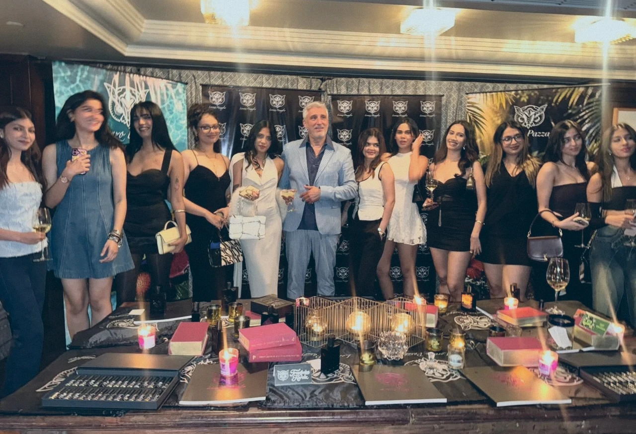 Guests in front of the branded backdrop at the Lorenzo Pazzaglia launch event, Mumbai, 2026